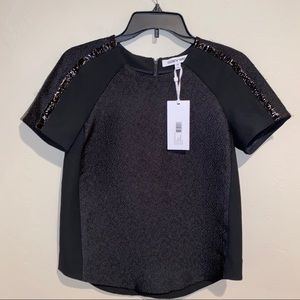 Elizabeth and James Cleo Top